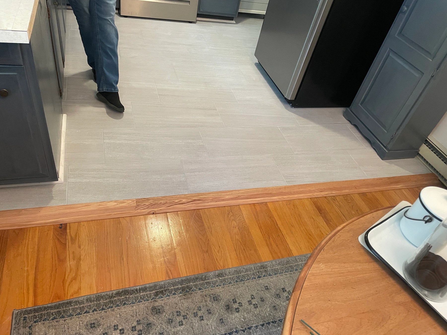Second view of a completed interior remodel with new flooring and trim