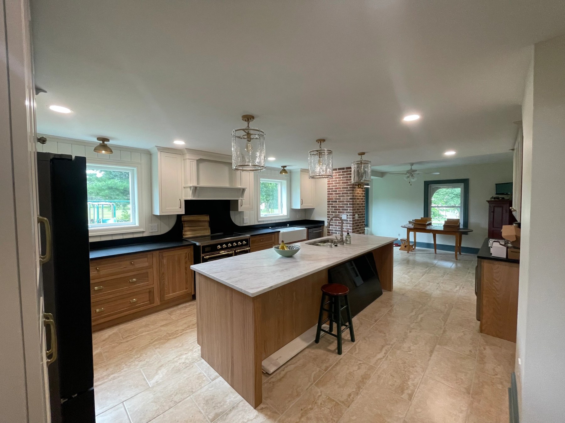 Wide view of the finished gambrel house kitchen after the structural remodel