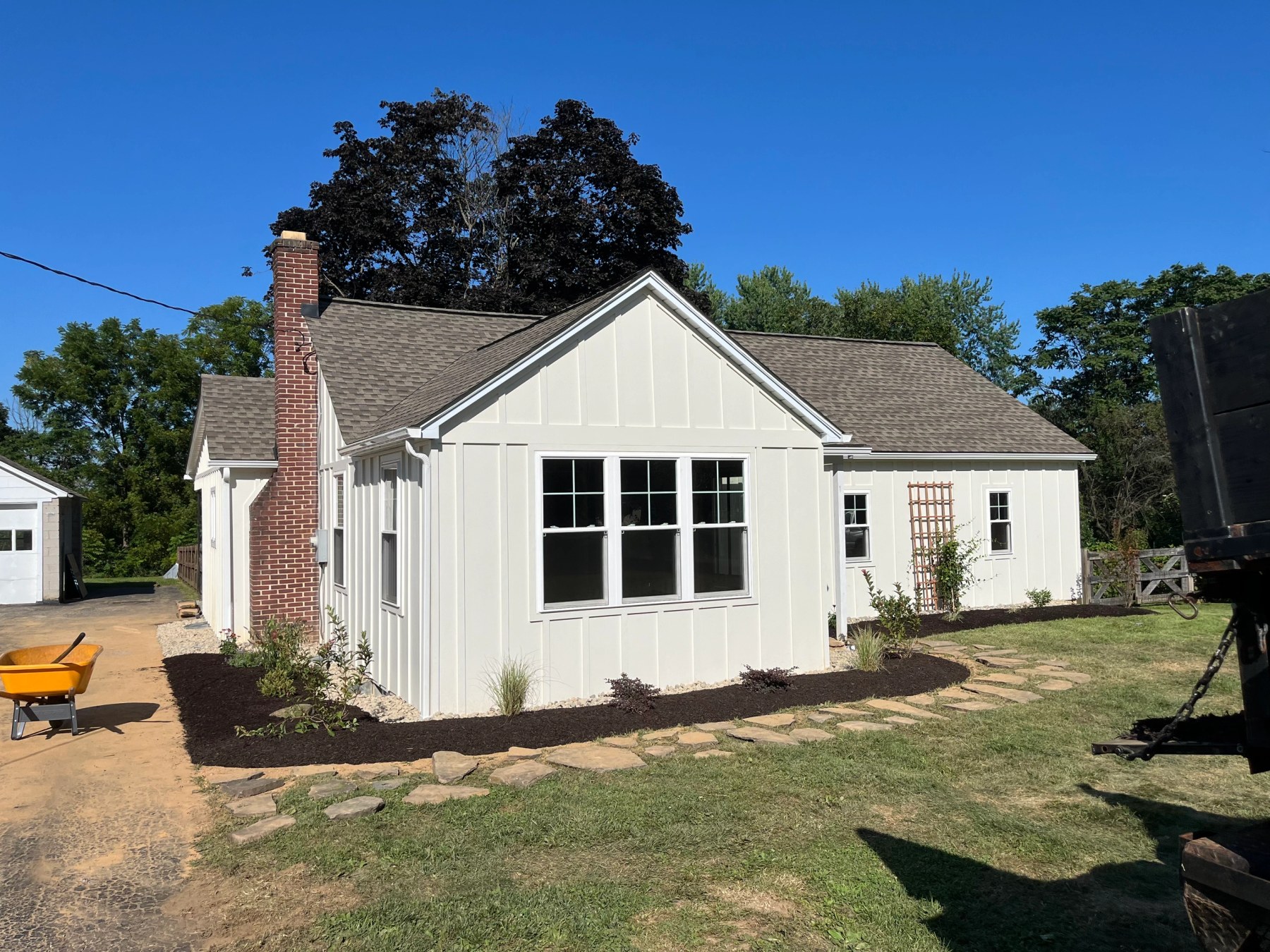 Completed siding replacement with new trim, soffit and fascia